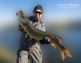 japanese-angler-with-pike-in-scotland