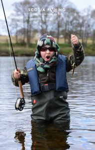 young-angler-with-first-ever-trout-on-the-fly